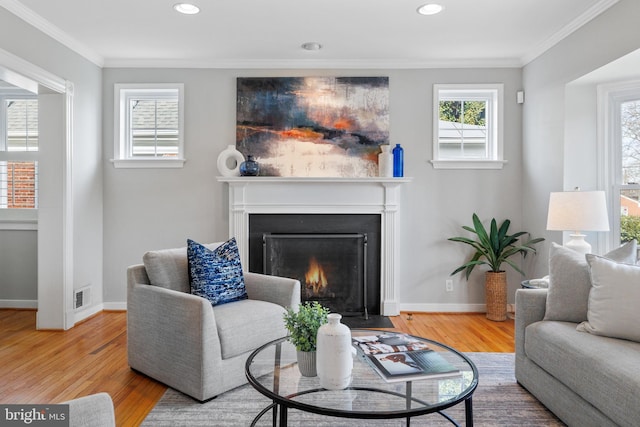 living room featuring hardwood / wood-style floors and ornamental molding