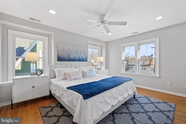 bedroom featuring ceiling fan and dark hardwood / wood-style floors