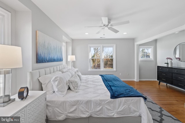 bedroom with wood-type flooring and ceiling fan