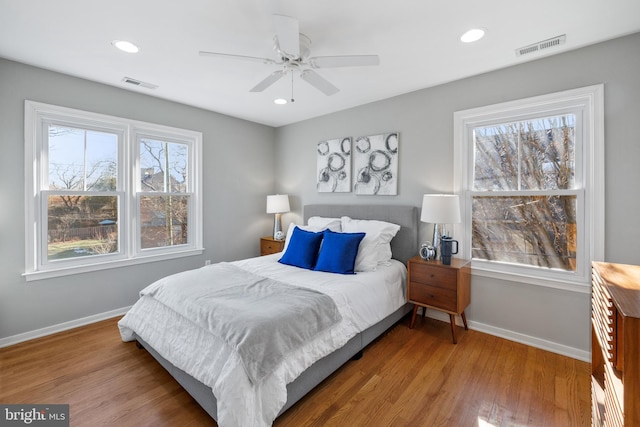 bedroom featuring hardwood / wood-style floors and ceiling fan