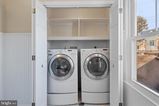 washroom with washing machine and dryer