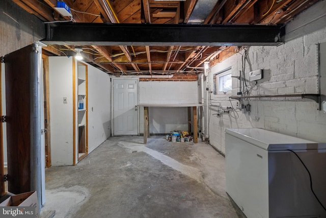 basement featuring fridge