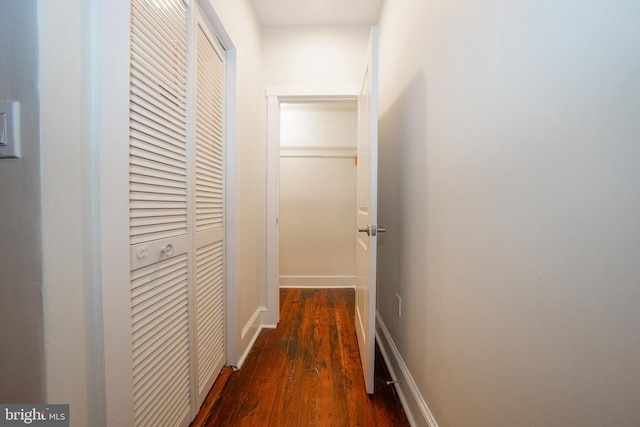 hall with dark wood-type flooring