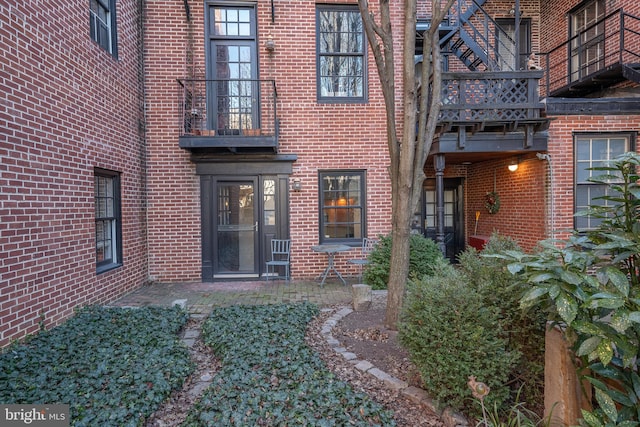 entrance to property featuring a balcony