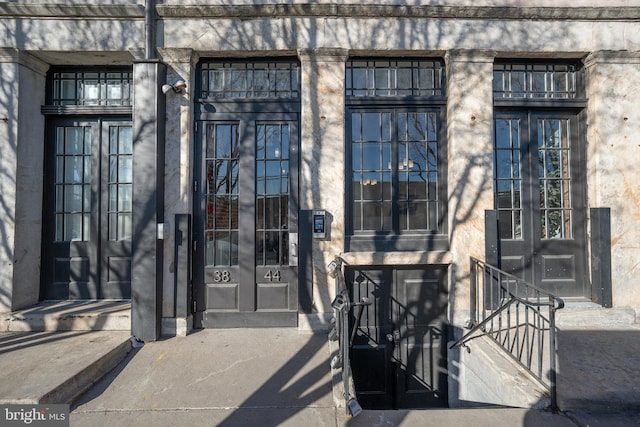 view of exterior entry featuring french doors