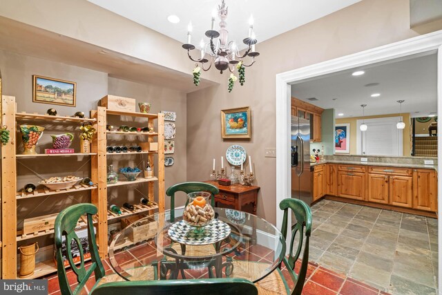 dining space featuring an inviting chandelier