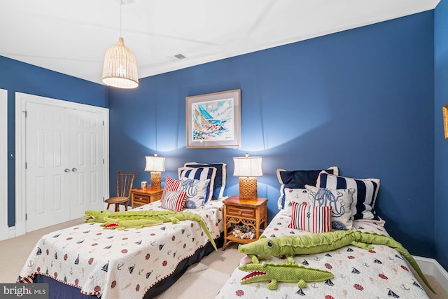 carpeted bedroom with a closet