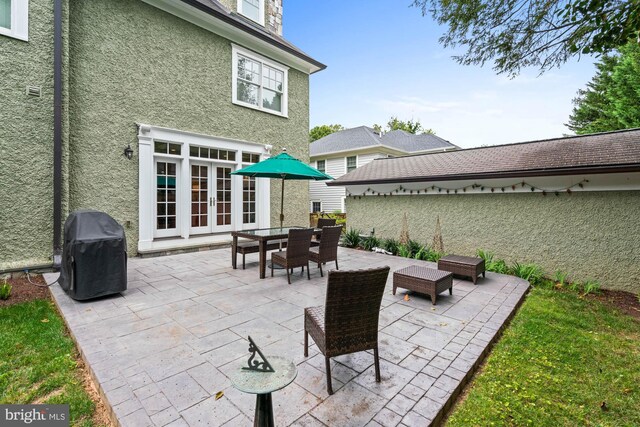 view of patio / terrace featuring french doors and a grill