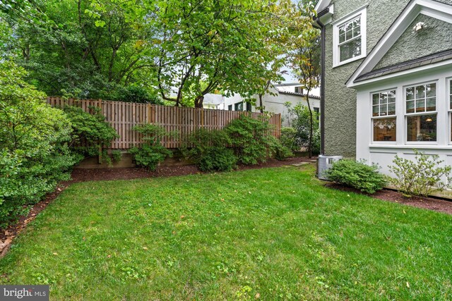 view of yard with central AC unit