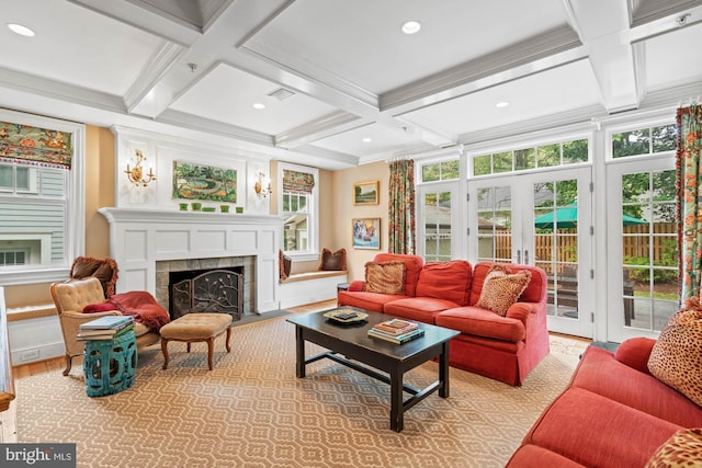 sunroom / solarium with coffered ceiling, a fireplace, french doors, and beamed ceiling