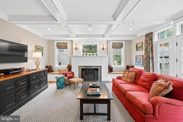 living room featuring coffered ceiling, a fireplace, crown molding, and beamed ceiling