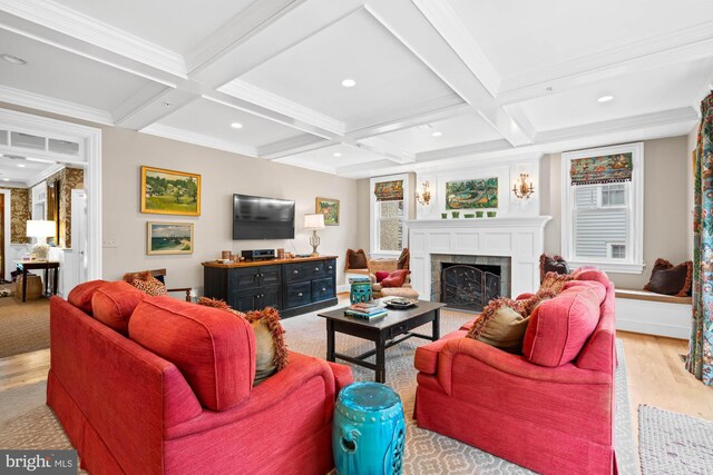 living room featuring coffered ceiling, beam ceiling, and light hardwood / wood-style floors