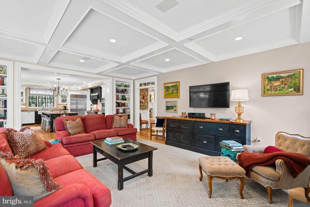 living room featuring coffered ceiling, beam ceiling, light hardwood / wood-style flooring, and a notable chandelier