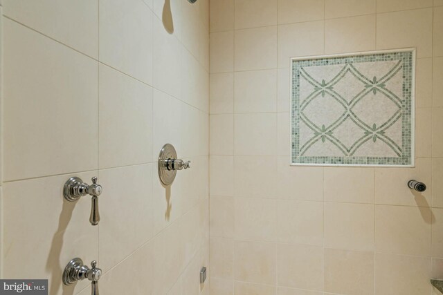 bathroom with a tile shower