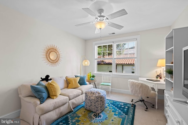 carpeted office with ceiling fan