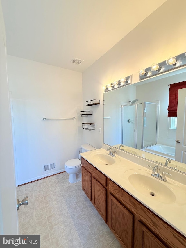 full bathroom with vanity, independent shower and bath, and toilet