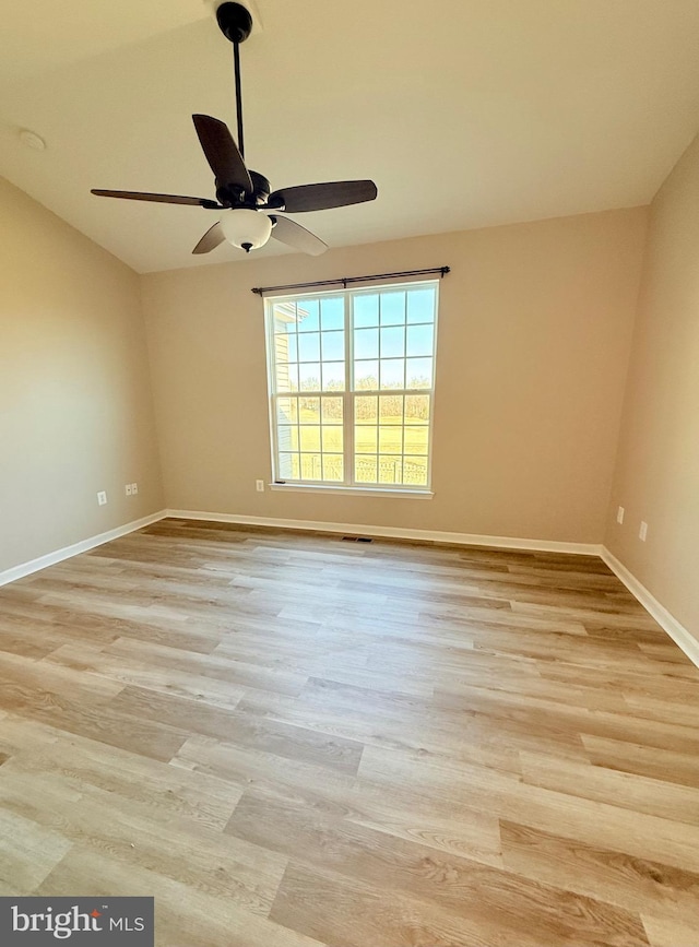 empty room featuring ceiling fan and light hardwood / wood-style flooring