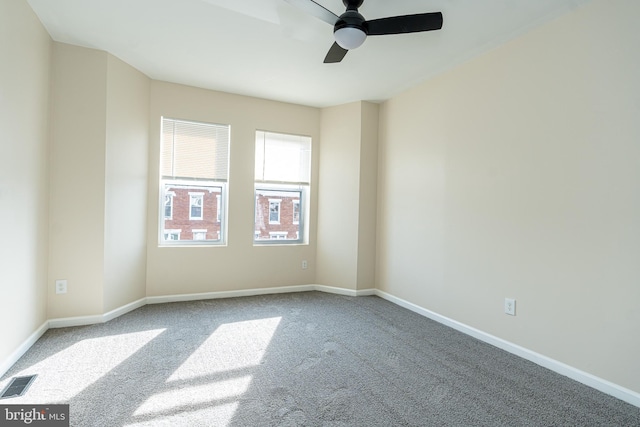 carpeted empty room with ceiling fan