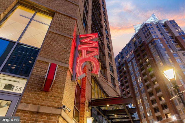 view of outdoor building at dusk