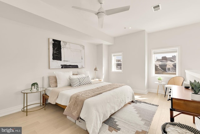 bedroom with ceiling fan and light hardwood / wood-style flooring