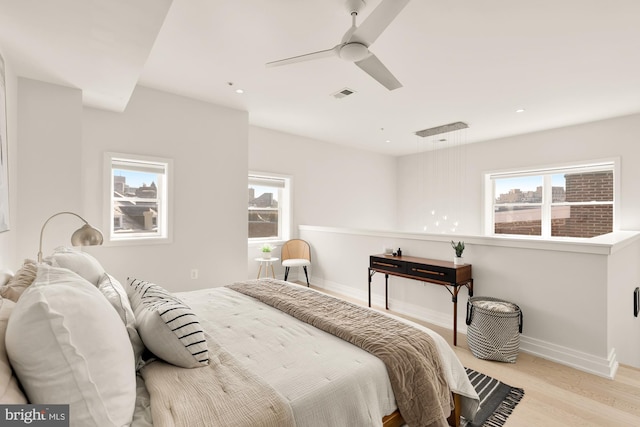 bedroom featuring ceiling fan and light hardwood / wood-style floors