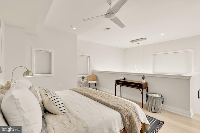 bedroom featuring ceiling fan and light hardwood / wood-style flooring