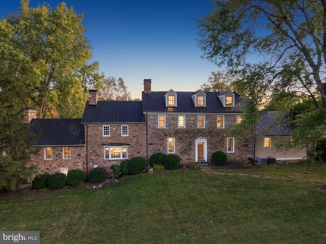 view of front of home with a lawn