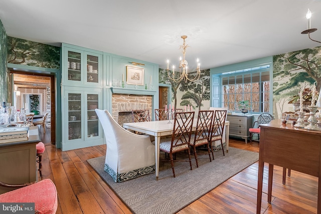 dining room featuring hardwood / wood-style floors and a notable chandelier