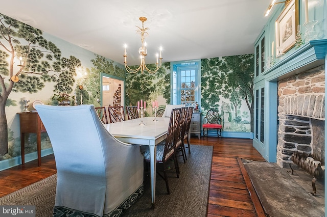 dining space featuring dark wood-type flooring and a chandelier