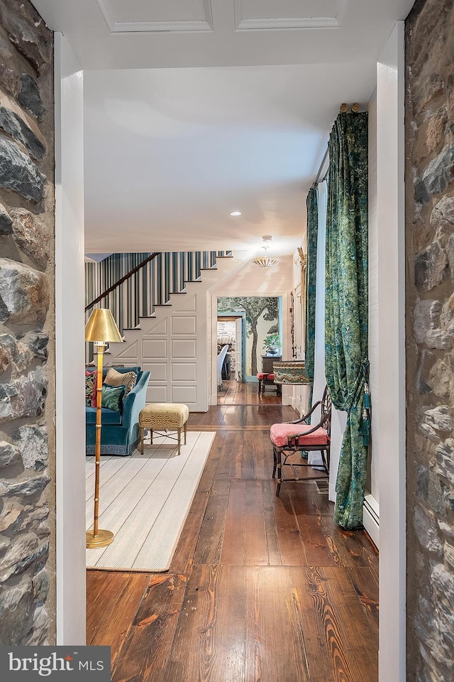 corridor featuring wood-type flooring