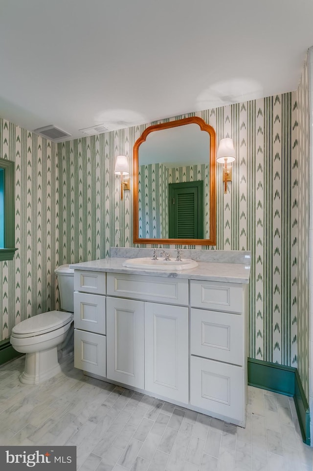 bathroom with vanity and toilet