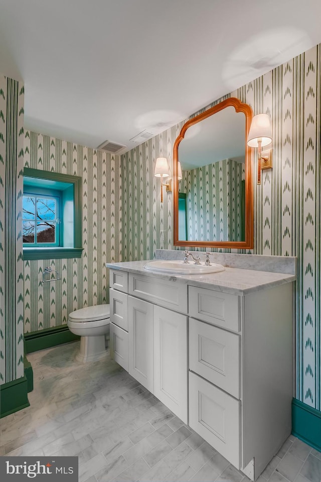 bathroom with vanity and toilet