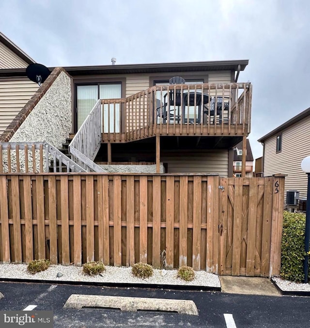 exterior space with central AC and a deck