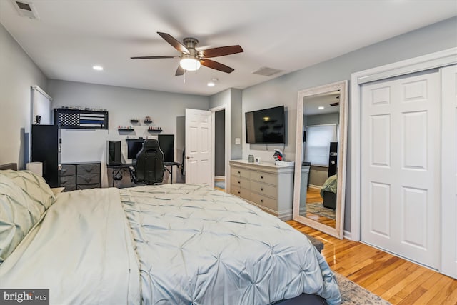 bedroom with wood-type flooring and ceiling fan