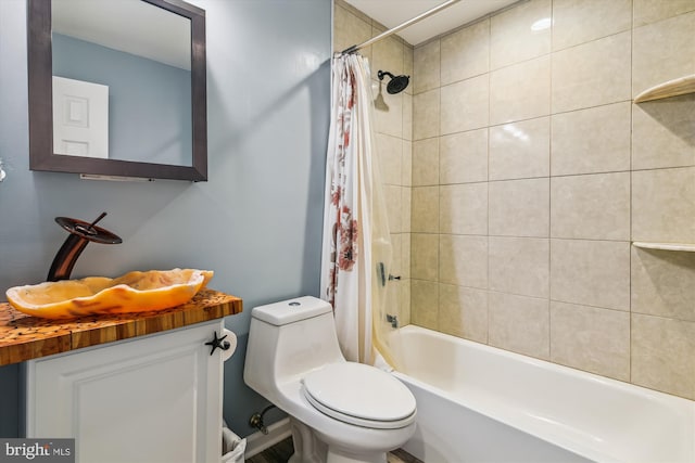 full bathroom with vanity, shower / bath combo with shower curtain, and toilet