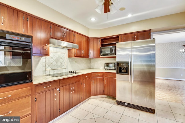 kitchen featuring backsplash, ceiling fan, light tile patterned floors, and black appliances