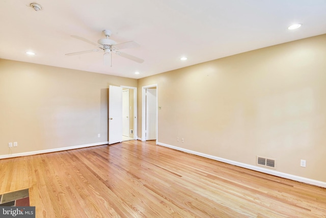 unfurnished room featuring ceiling fan and light wood-type flooring