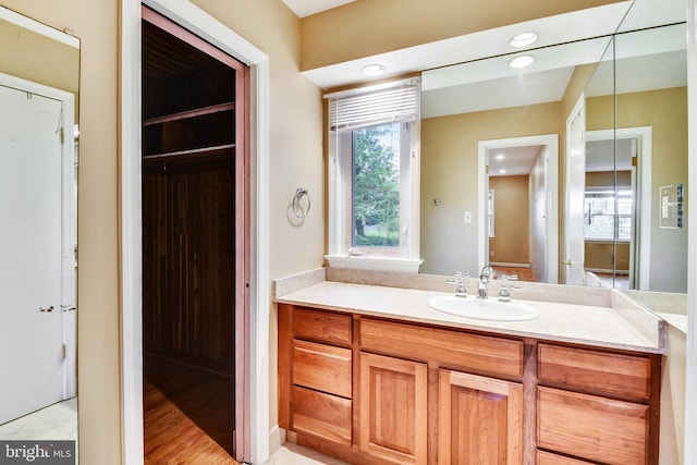 bathroom featuring a healthy amount of sunlight and vanity