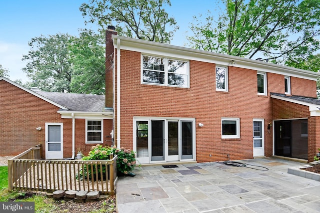 back of house with a patio