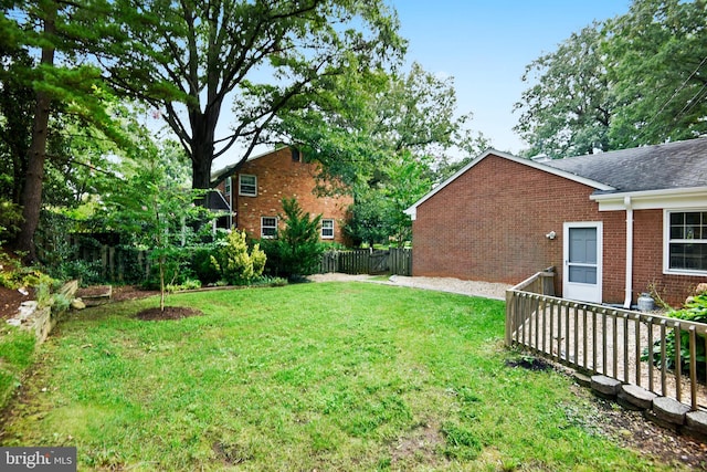 view of yard with a wooden deck