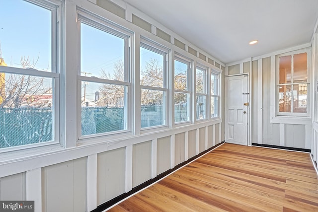 unfurnished sunroom with a wealth of natural light