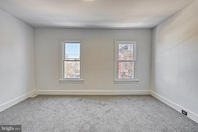 spare room featuring carpet floors