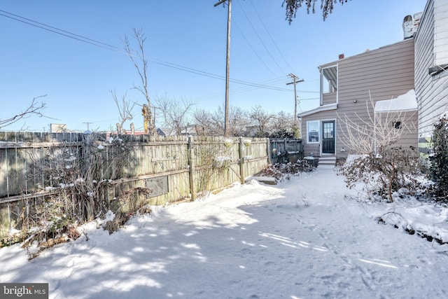 view of yard covered in snow