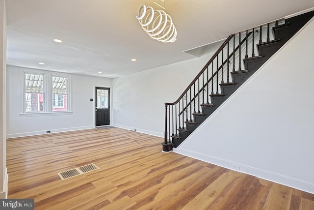 foyer entrance featuring hardwood / wood-style flooring