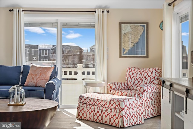 sitting room with light hardwood / wood-style floors