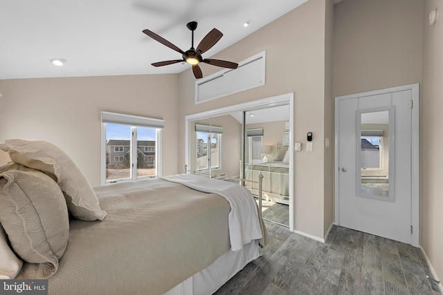 bedroom featuring a closet, high vaulted ceiling, dark hardwood / wood-style floors, and ceiling fan