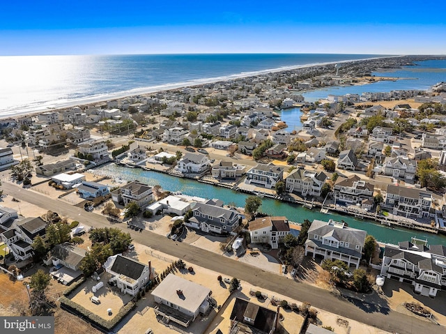 aerial view featuring a water view and a beach view