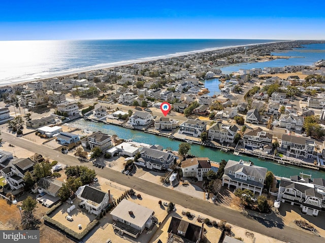 bird's eye view featuring a beach view and a water view