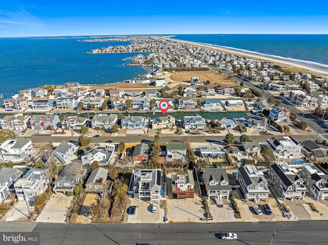 aerial view featuring a water view and a beach view