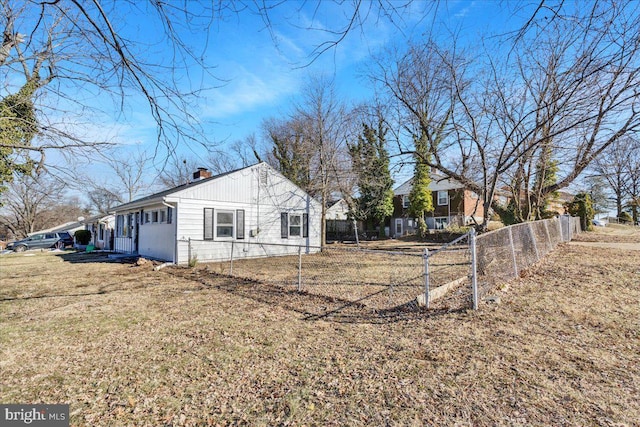 view of home's exterior with a yard